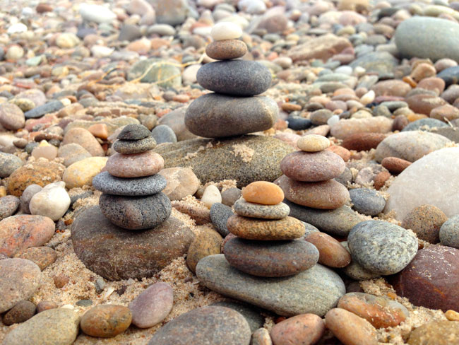Cairns - stacked stones on beach
